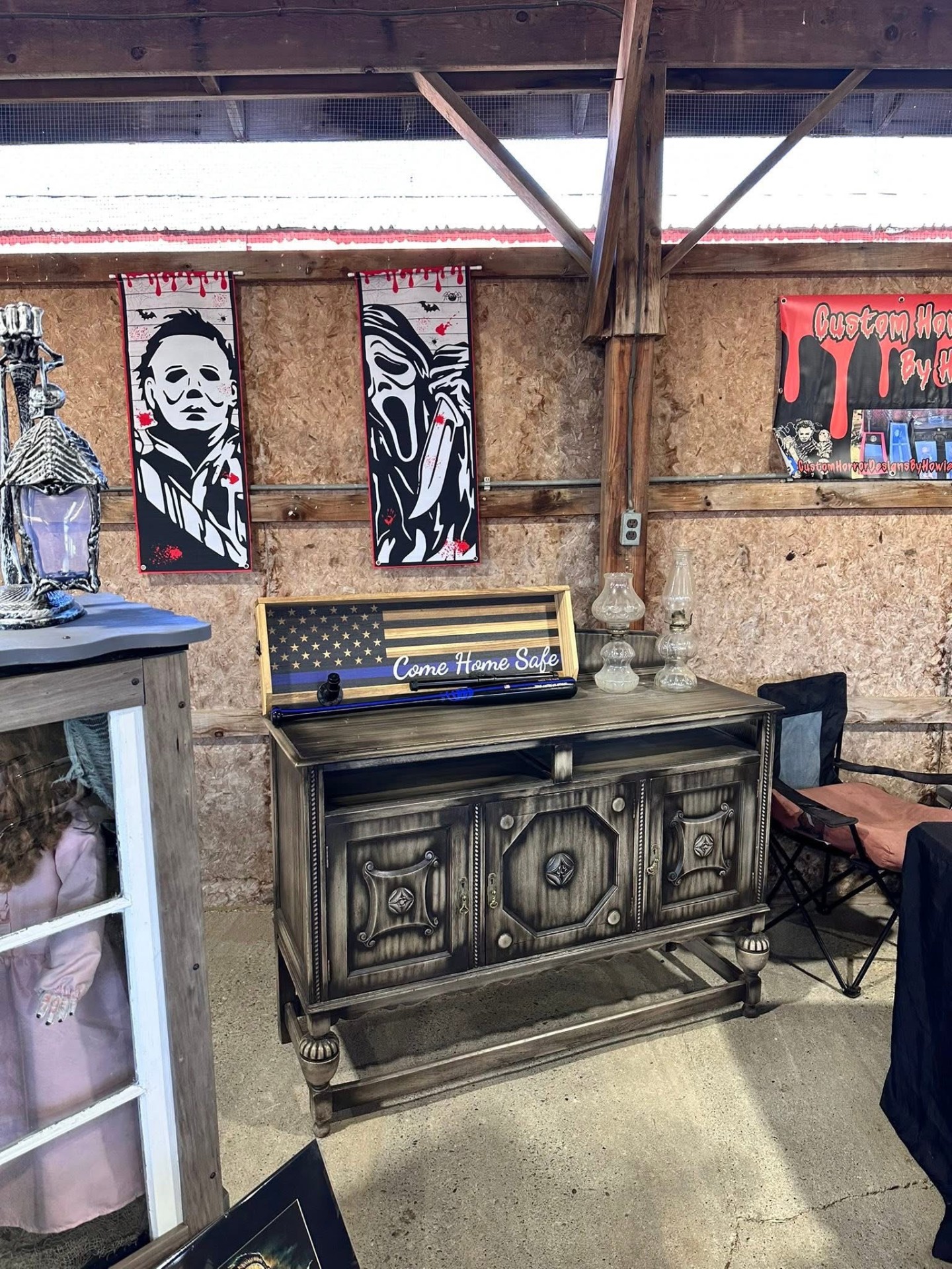 Custom horror studio booth with banners and refinished cabinet